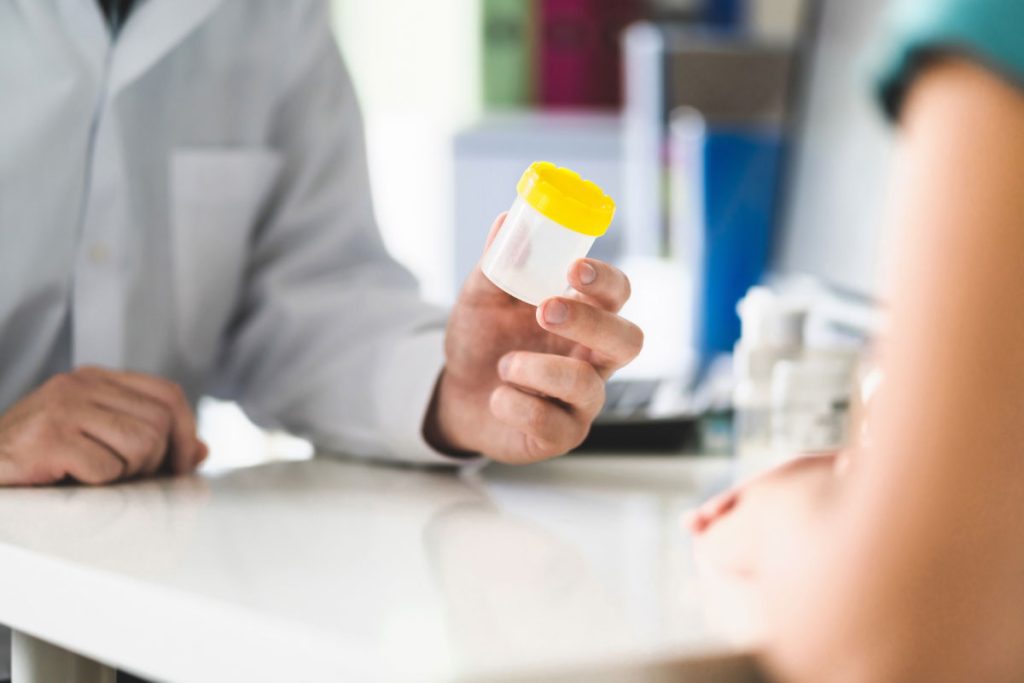 Fleet manager reviewing DOT drug testing requirements for CDL drivers