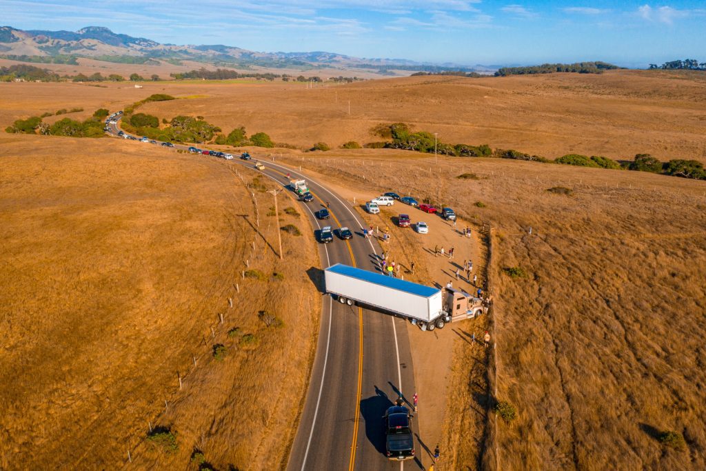 Law enforcement officers responding to a commercial truck accident as part of an accident investigation