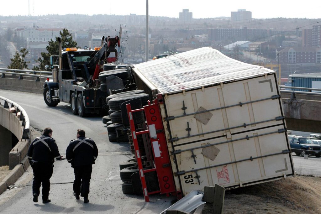 Commercial truck overturned after an accident as part of fleet safety incident investigation