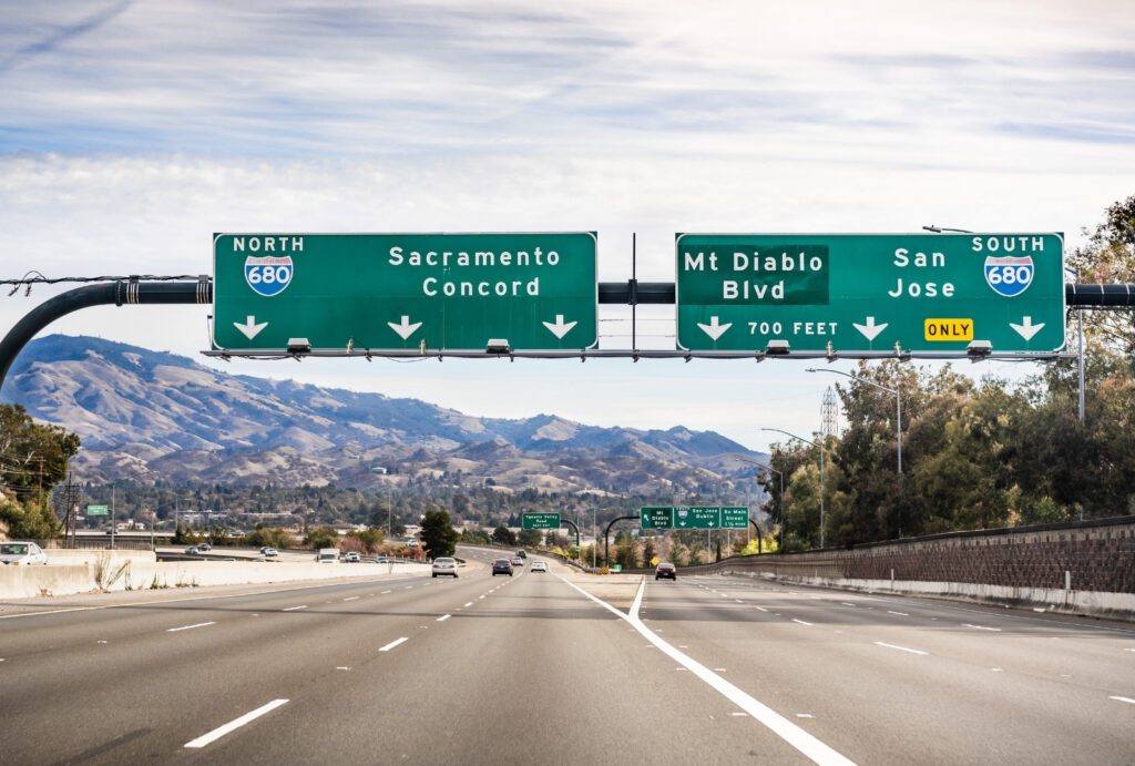 Freeway signs illustrating English-language highway sign comprehension for commercial drivers